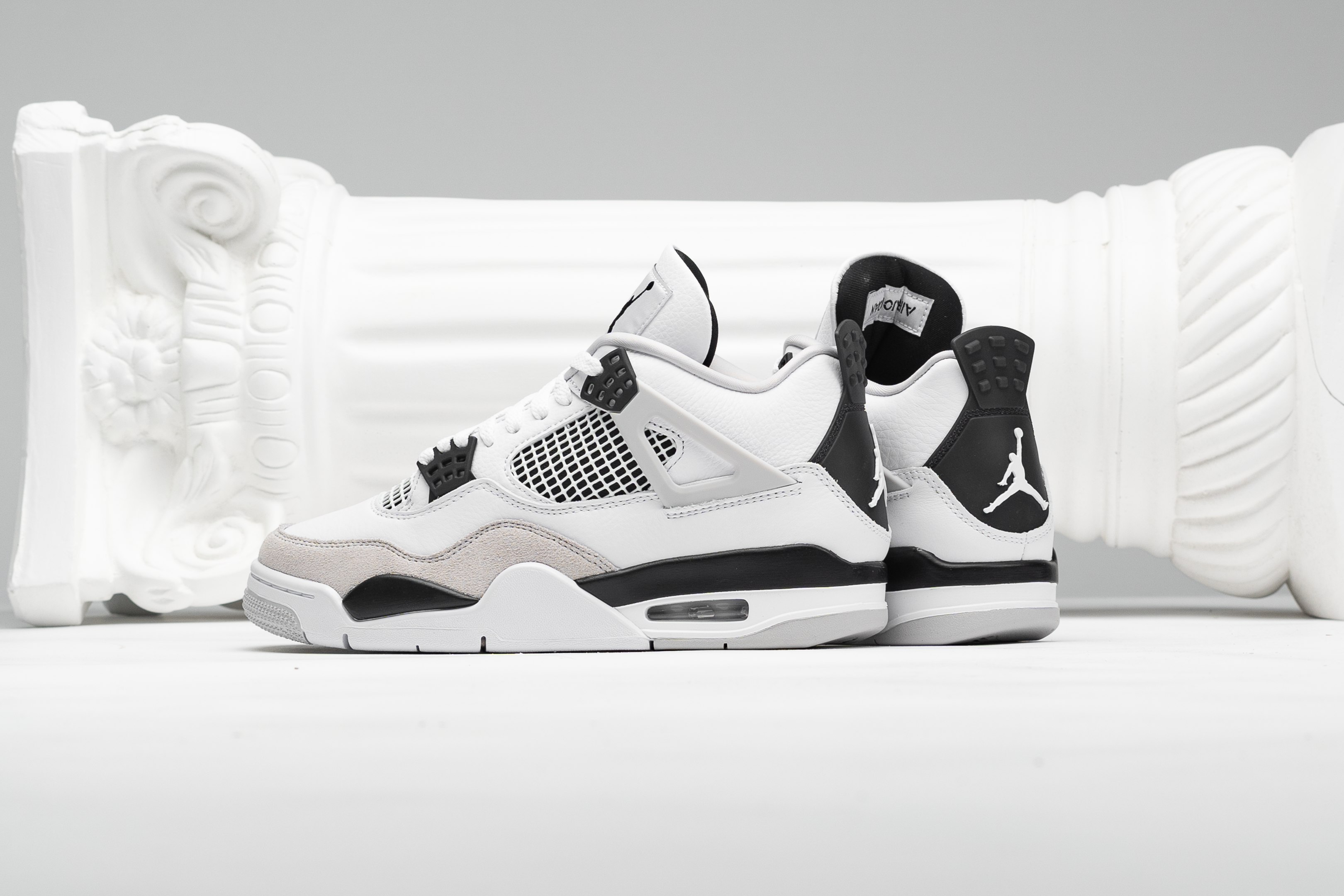 Jordan 4s black and white online