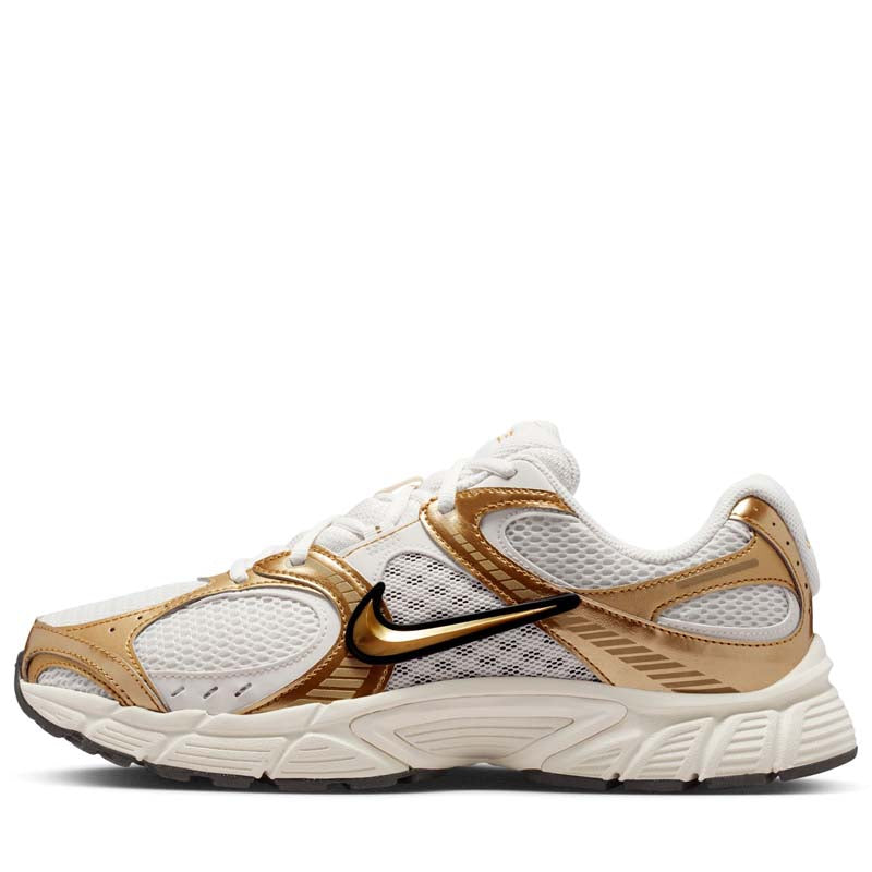 gold color nike shoes