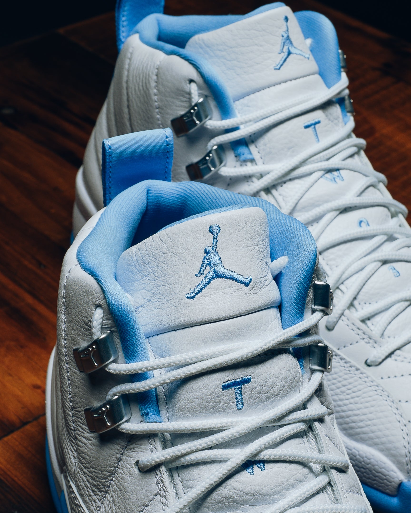 teal and white jordan 12